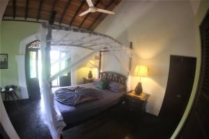 an overhead view of a bedroom with a canopy bed at The Spice House Mirissa in Mirissa