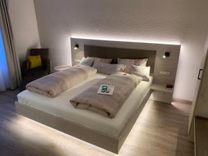 Postel nebo postele na pokoji v ubytování Apart Hotel Norden