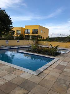 Swimming pool sa o malapit sa Flat no Condomínio Paraíso Serra Negra - A 200m da Bodega de Véio