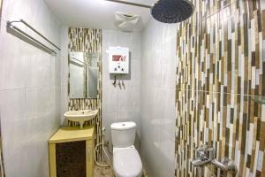 Koupelna v ubytování Tini's Guest House Malang Mitra RedDoorz