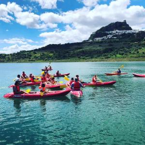 a group of people in kayaks on a body of water at Casa Baraka in Algodonales