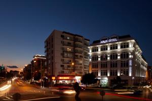 a building on a city street at night at Arus Hotel in Eskisehir