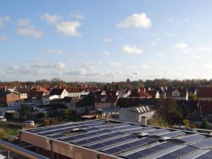 a group of solar panels on the roofs of a city at Speicher Residenz Barth E4 App 9 in Barth
