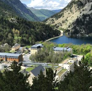 an aerial view of a town next to a lake at Hotel Continental Balneario de Panticosa in Panticosa