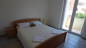 Postel nebo postele na pokoji v ubytování Apartment Grahovac 4