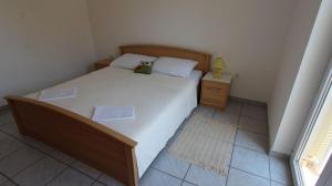 Postel nebo postele na pokoji v ubytování Apartment Grahovac 4