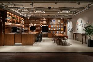 a tasting room with a table and chairs in a building at HOTEL ANTEROOM SEOUL in Seoul