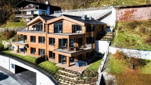 an aerial view of a house with a roof at Premium Apartments Adlerhorst by we rent in Zell am See