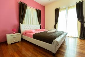 Ένα ή περισσότερα κρεβάτια σε δωμάτιο στο La Terra Nostra 