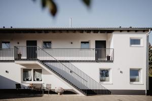 an external view of a building with a staircase at Rheinzeit-Weisweil in Weisweil
