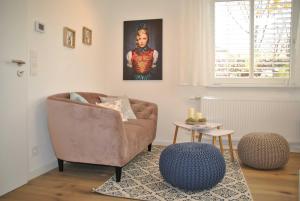 a living room with a couch and a table at Ferienwohnung Finja in Bad Dürrheim