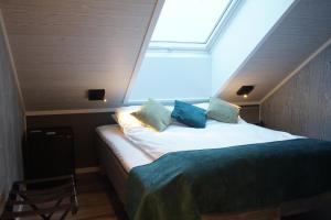 Ліжко або ліжка в номері Senja Fjordhotell and Apartments