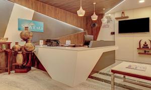 a lobby of a restaurant with a counter at Treebo Trend Seaesta RK Beach in Visakhapatnam