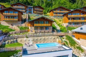 an aerial view of a resort with a swimming pool at Apartment Dorf Wagrain Alpenleben by AlpenTravel in Wagrain