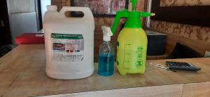 two bottles of detergents sitting on a table at Ashiyana Inn Hotel in Ajmer