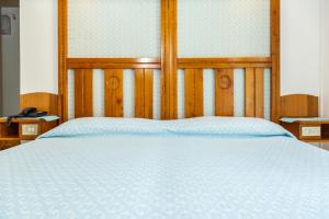 Postel nebo postele na pokoji v ubytování Albergo Miramare