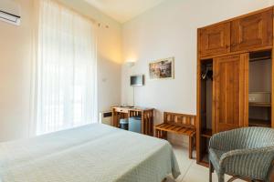 Postel nebo postele na pokoji v ubytování Albergo Miramare