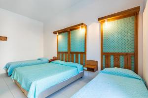 Postel nebo postele na pokoji v ubytování Albergo Miramare