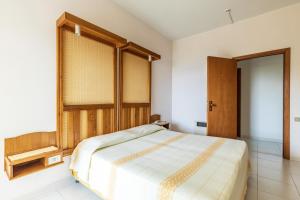 Postel nebo postele na pokoji v ubytování Albergo Miramare