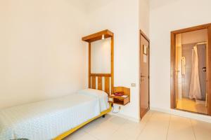 Postel nebo postele na pokoji v ubytování Albergo Miramare