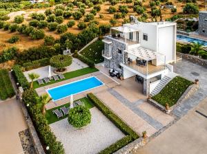 an aerial view of a house with a swimming pool at Aroma Villas in Hersonissos