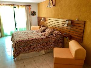 Postel nebo postele na pokoji v ubytování Hotel Complejo Najul Suites-Solo Adultos
