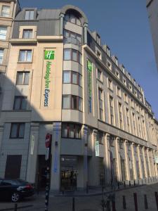 a large building with signs on the front of it at Holiday Inn Express Brussels-Grand-Place, an IHG Hotel in Brussels