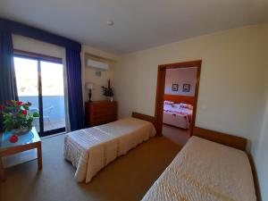 Säng eller sängar i ett rum på Hotel das Taipas