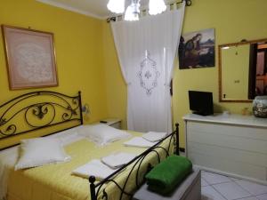 Łóżko lub łóżka w pokoju w obiekcie La Fenice