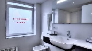 Ein Badezimmer in der Unterkunft Hotel Tristar