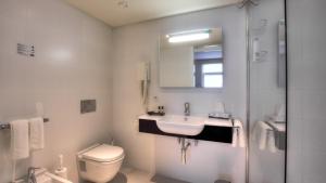 Ein Badezimmer in der Unterkunft Hotel Tristar