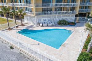 a large swimming pool in front of a building at 214 COV - Go Fly a Kite - Oceanfront Condo - 2 Pools in Folly Beach