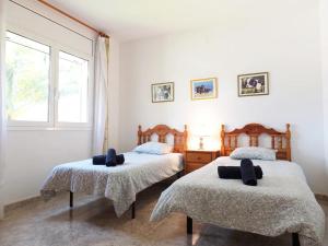 Posteľ alebo postele v izbe v ubytovaní Villa Nerea with air conditioning & private swimming pool only 400m to the beach ideal for families