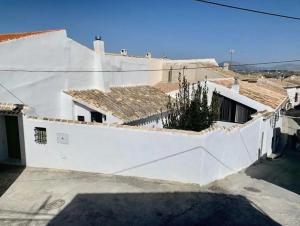 a white house with white walls and roofs at Astarte House 6 pax up in Galera