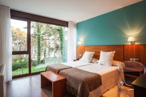 
Cama o camas de una habitación en Hotel Alén do Mar
