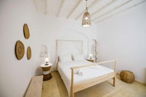 Ένα ή περισσότερα κρεβάτια σε δωμάτιο στο Marvi House +41 φωτογραφίες