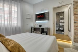 Postel nebo postele na pokoji v ubytování Gallery Suite