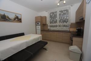 A kitchen or kitchenette at Ádám Guesthouse I.