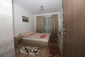 A bed or beds in a room at Ádám Guesthouse I.