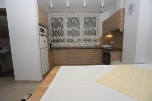A kitchen or kitchenette at Ádám Guesthouse I.