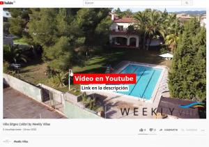 a video of a house with a sign that reads video on youtube link an in at Villa Sitges Colibri at 10 min Walk Beaches - Center City Amaizing Garden Pool XXL Private Tenis Piste in Vilanova i la Geltrú