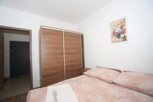 A bed or beds in a room at Ádám Guesthouse I.