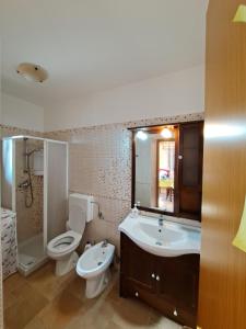 Koupelna v ubytování Torre Pali House + 23 fotografií