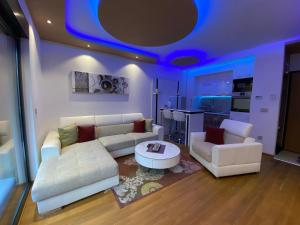 a living room with a couch and a table at Apartment Crystal in Zlatibor
