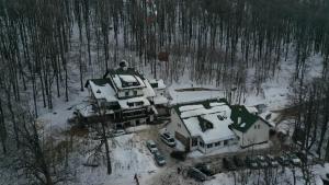 an aerial view of a house covered in snow at Guesthouse Babin Zub in Crni Vrh