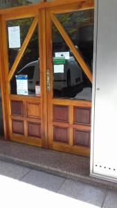 a wooden door with a car inside of it at Departamento Víctoria in Mar del Plata