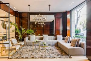 a living room with a couch and a table at CasaSur Recoleta in Buenos Aires