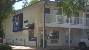 a building with a sign on the side of it at InTown Suites Extended Stay Select Atlanta GA - Morrow in Morrow