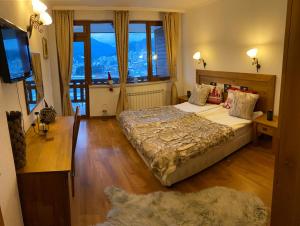 A bed or beds in a room at Rodope Nook Guest house