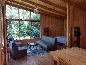 a living room with a couch and a table at Finca Terra Viva in Monteverde Costa Rica